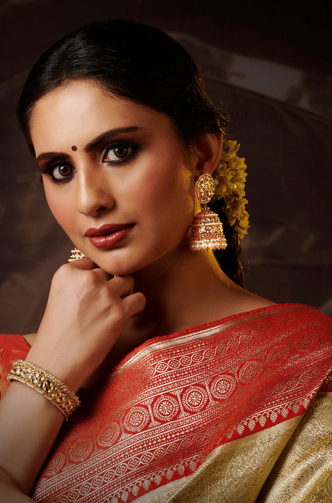 Gilded Elegance Kundan Pearl Jhumkas - Dyulokha