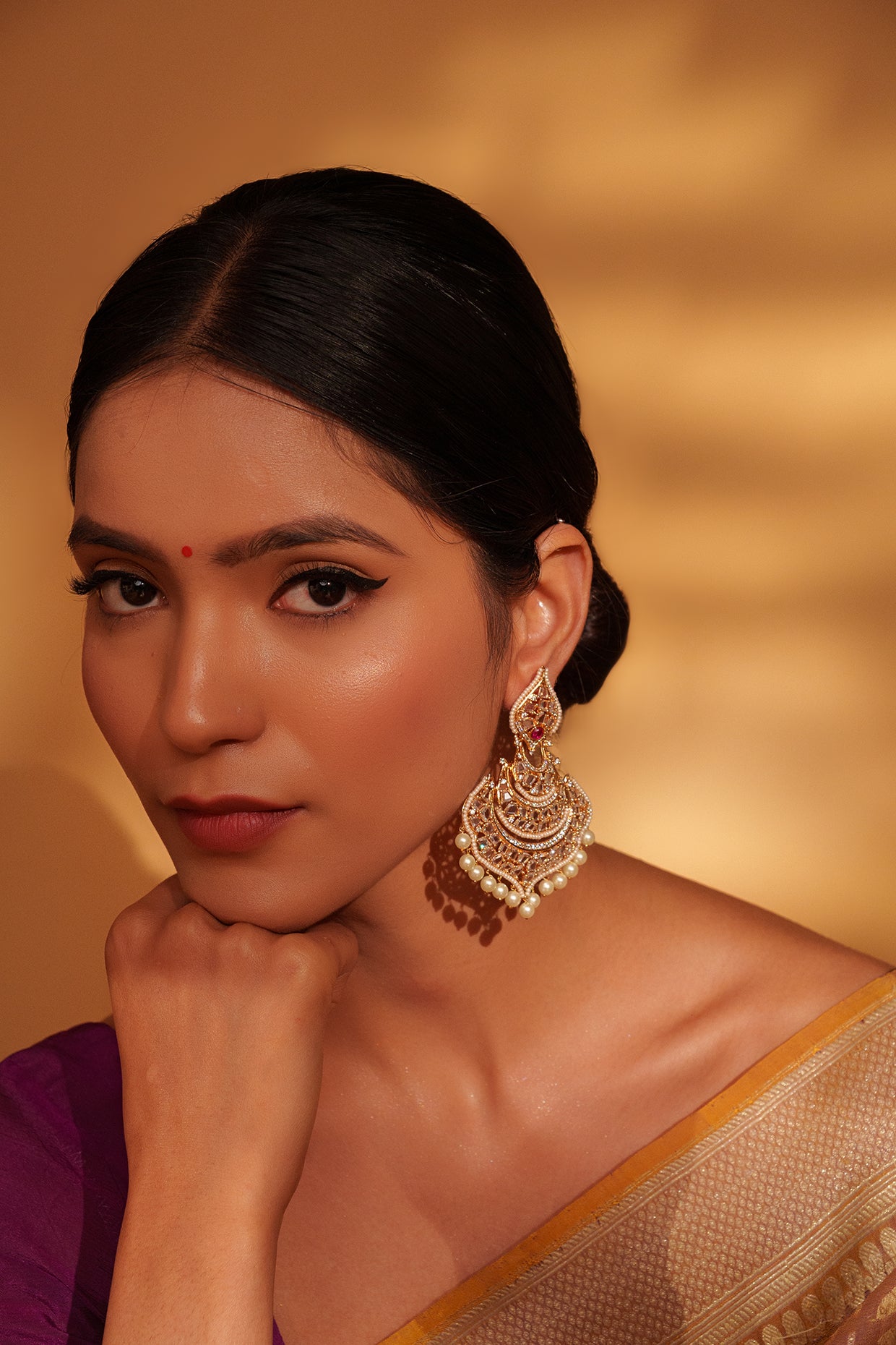 Festive Gold Chandbali Earrings with Kundan and Pearl Accents