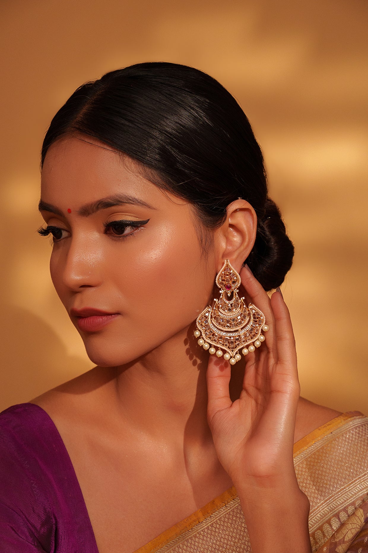 Festive Gold Chandbali Earrings with Kundan and Pearl Accents